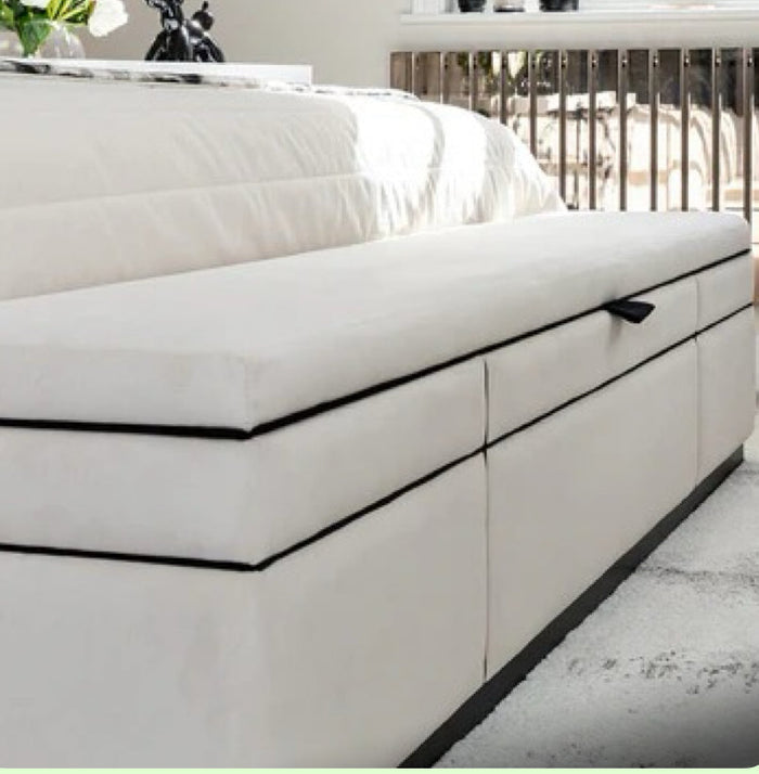 Custom Belle bed frame with a high panelled headboard in white fabric and built-in storage drawers.